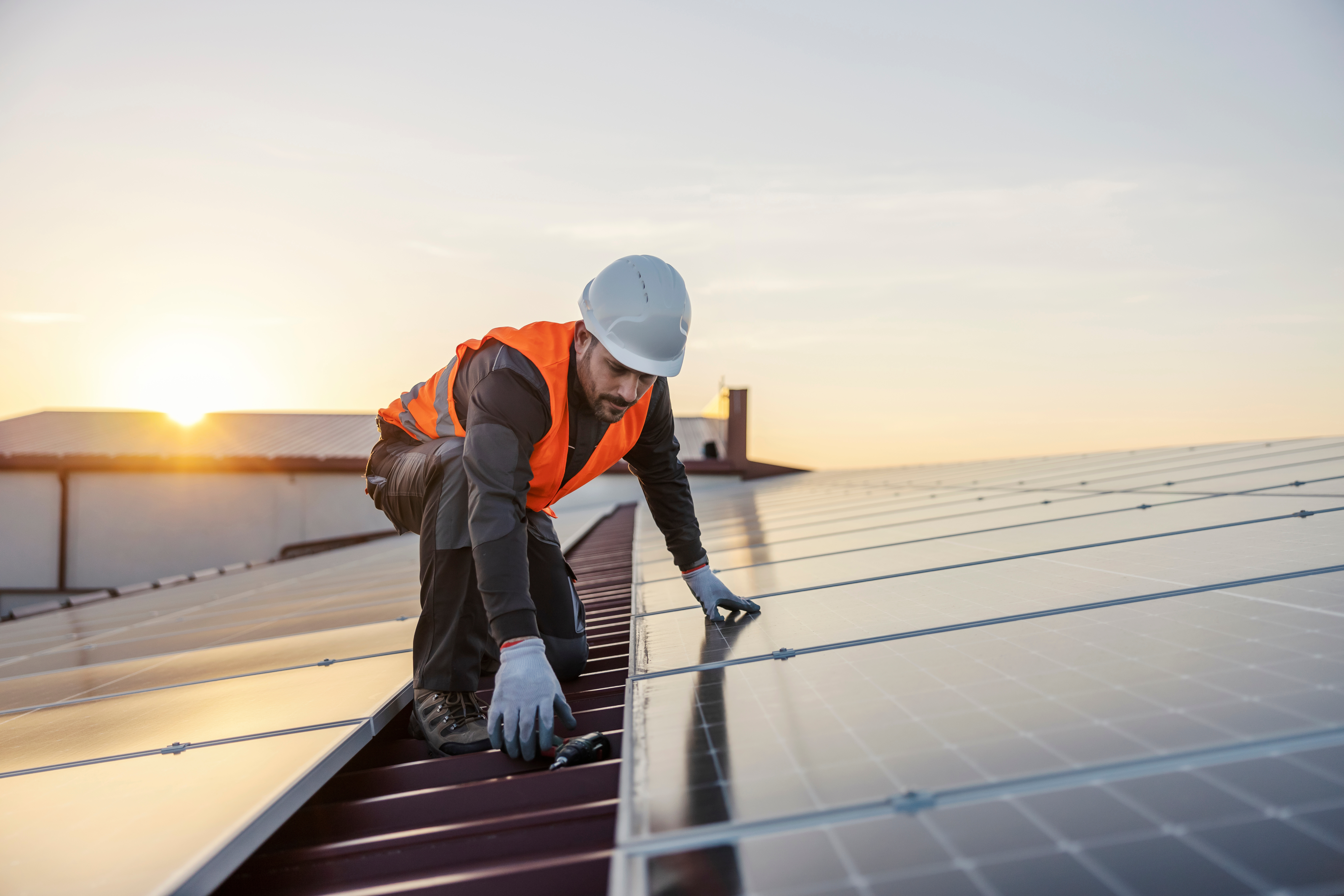 Solar worker installing panels.